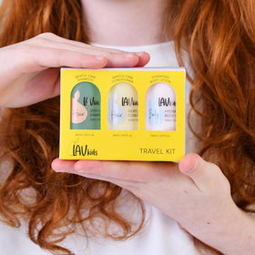 LAV KIDS set styled on bathroom shelf conveying tidy, family-friendly routine