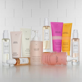 Le Monde Gourmand lifestyle with scarf suggesting cozy seasonal fragrance wear
