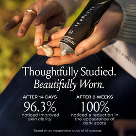 Le Prunier next to a 2 fl oz scale showing portable travel size