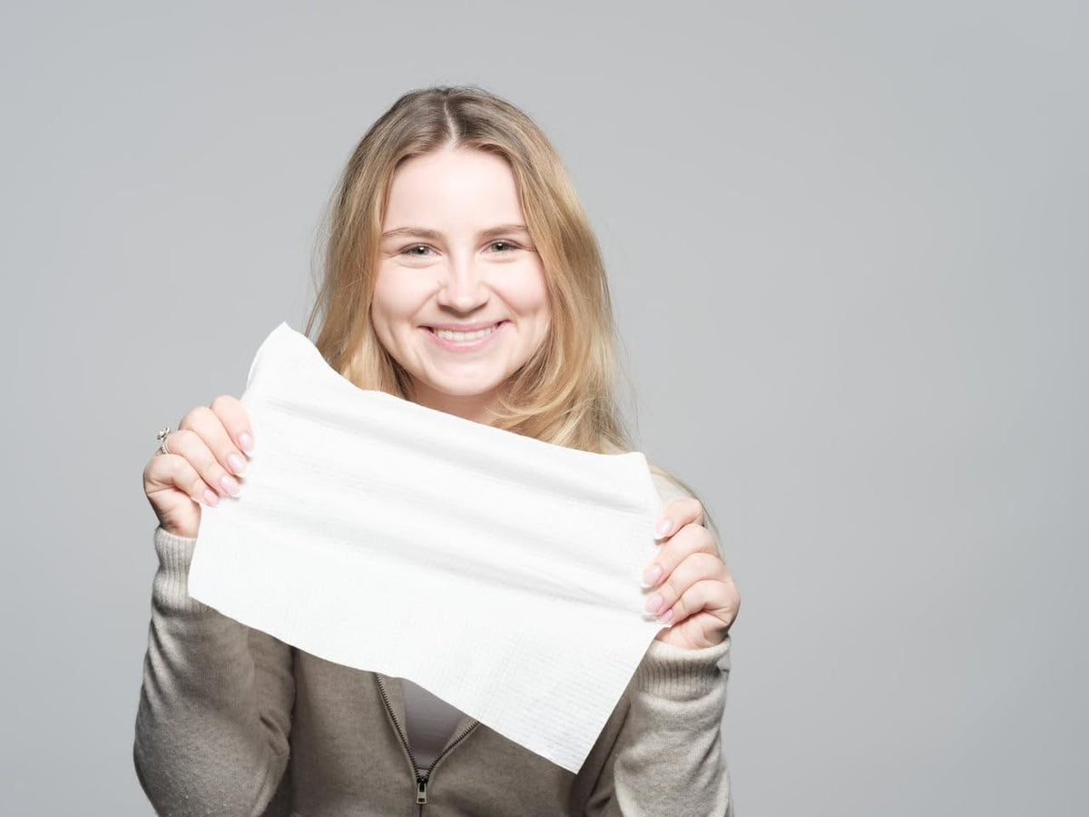 Le Visage towel saturated with water showing absorbent, durable performance
