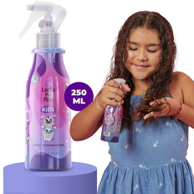 Leche Pal Pelo bottle in hand to show 8.4 oz size and scale