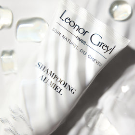 Leonor Greyl bottle held to show size and scale, useful for travel planning
