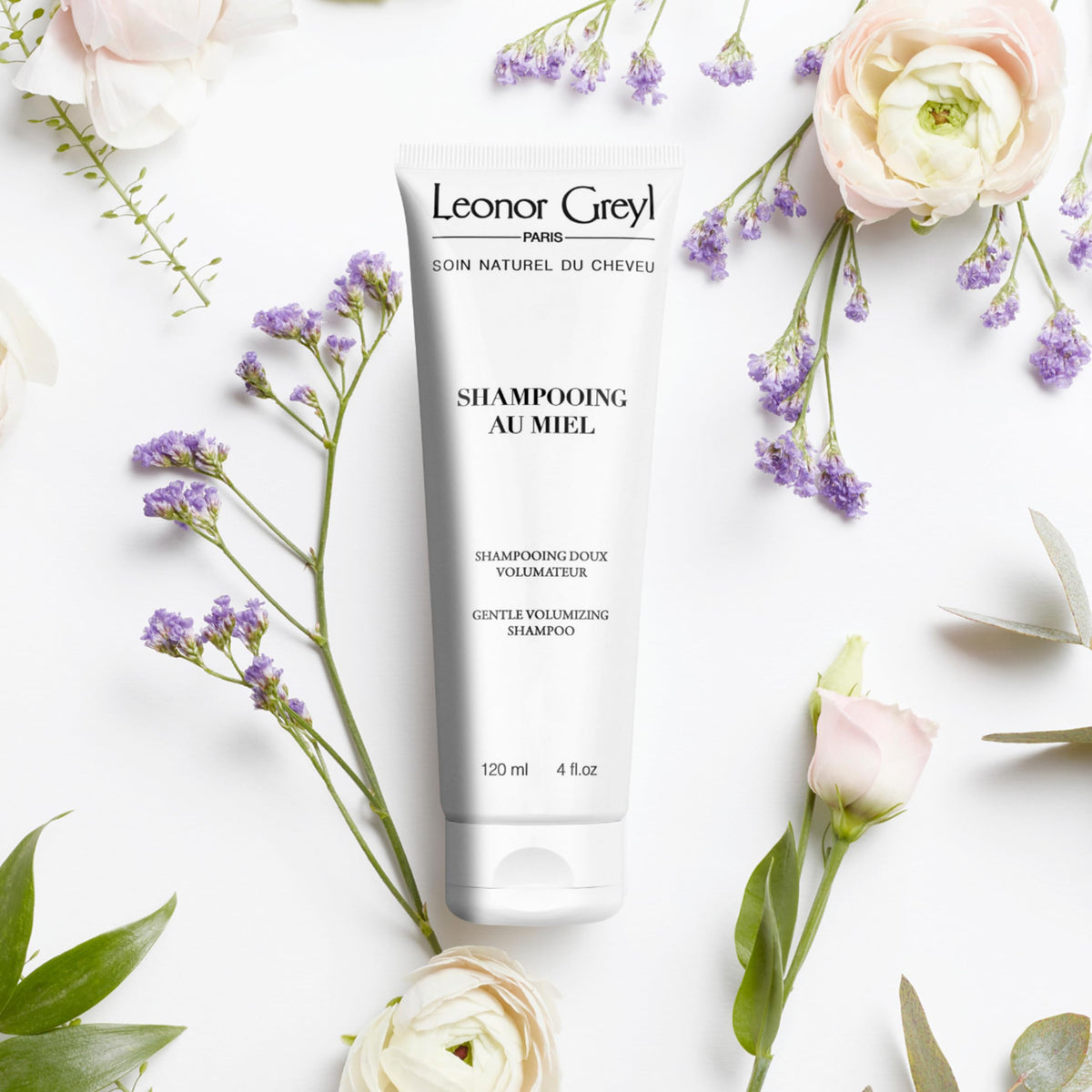 Leonor Greyl dispensing shampoo texture in hand, shows creamy lather benefit
