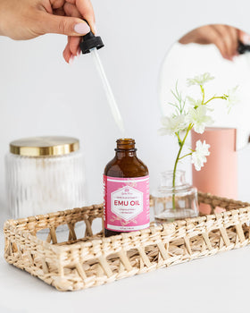 Leven Rose oil texture close-up on fingertip, smooth moisturizing finish benefit