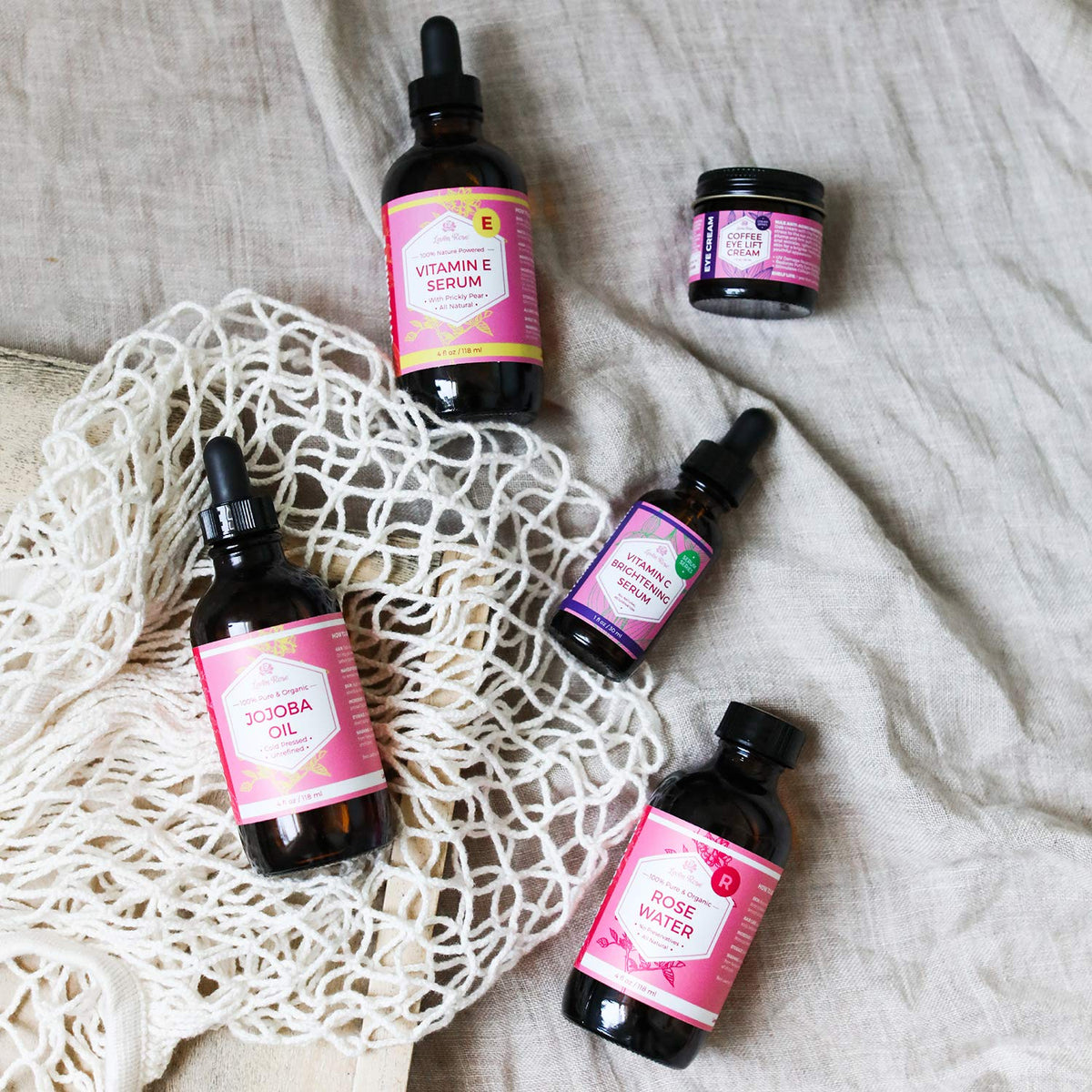 Leven Rose bottle in hand for scale showing portable 4 oz convenience benefit