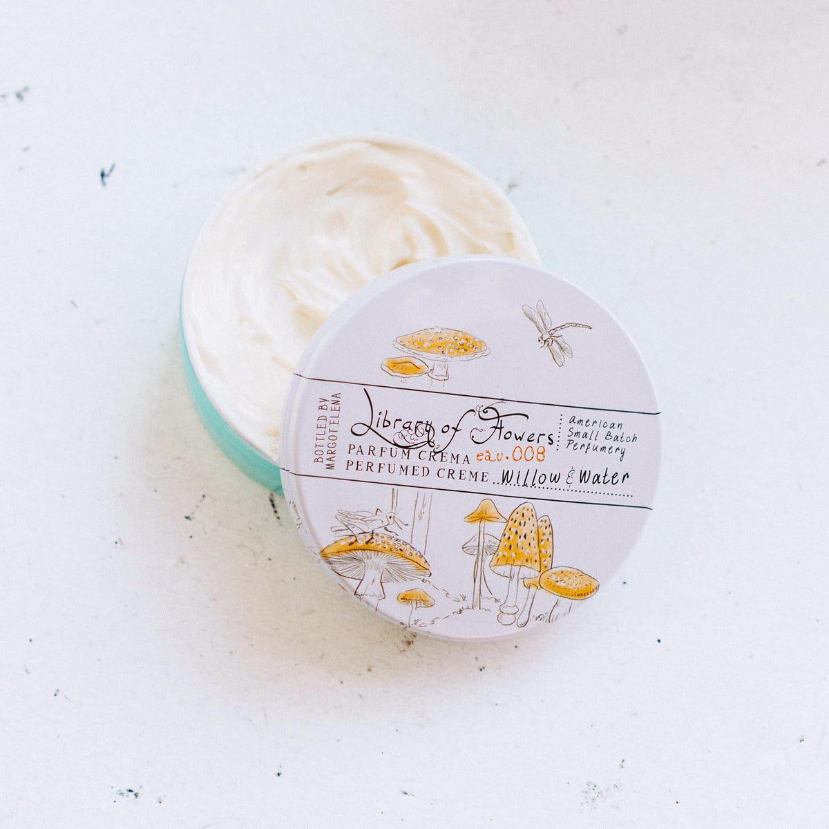 Library of Flowers fingertip applying parfum crema demonstrating precise touch application