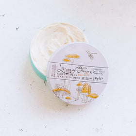 Library of Flowers fingertip applying parfum crema demonstrating precise touch application
