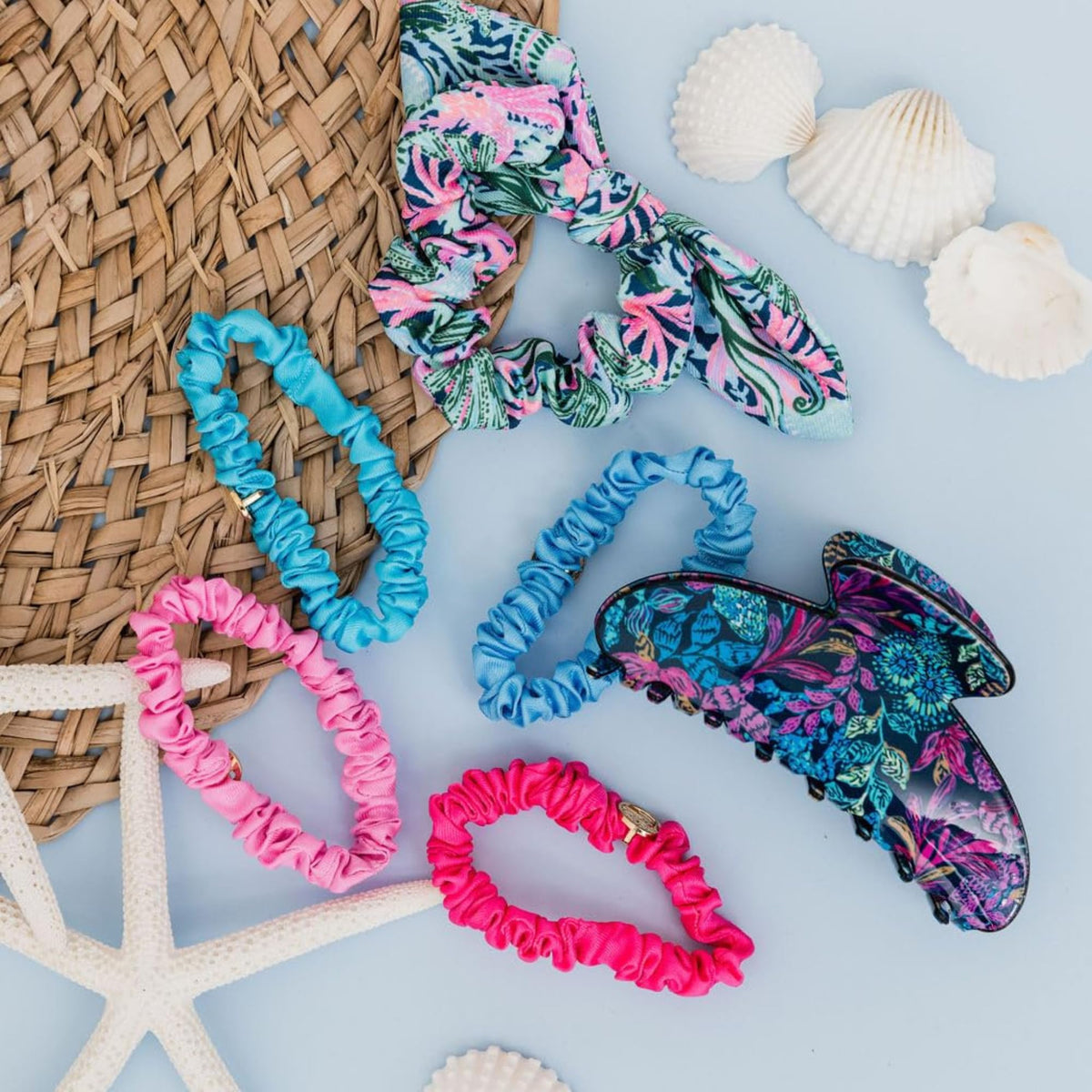 Lilly Pulitzer scrunchies flatlay with outfit pieces showing styling possibilities