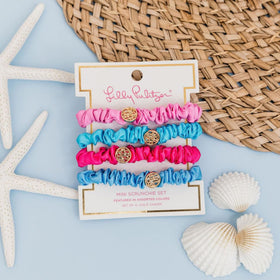 Lilly Pulitzer scrunchie worn around wrist as stylish accessory and practical hold
