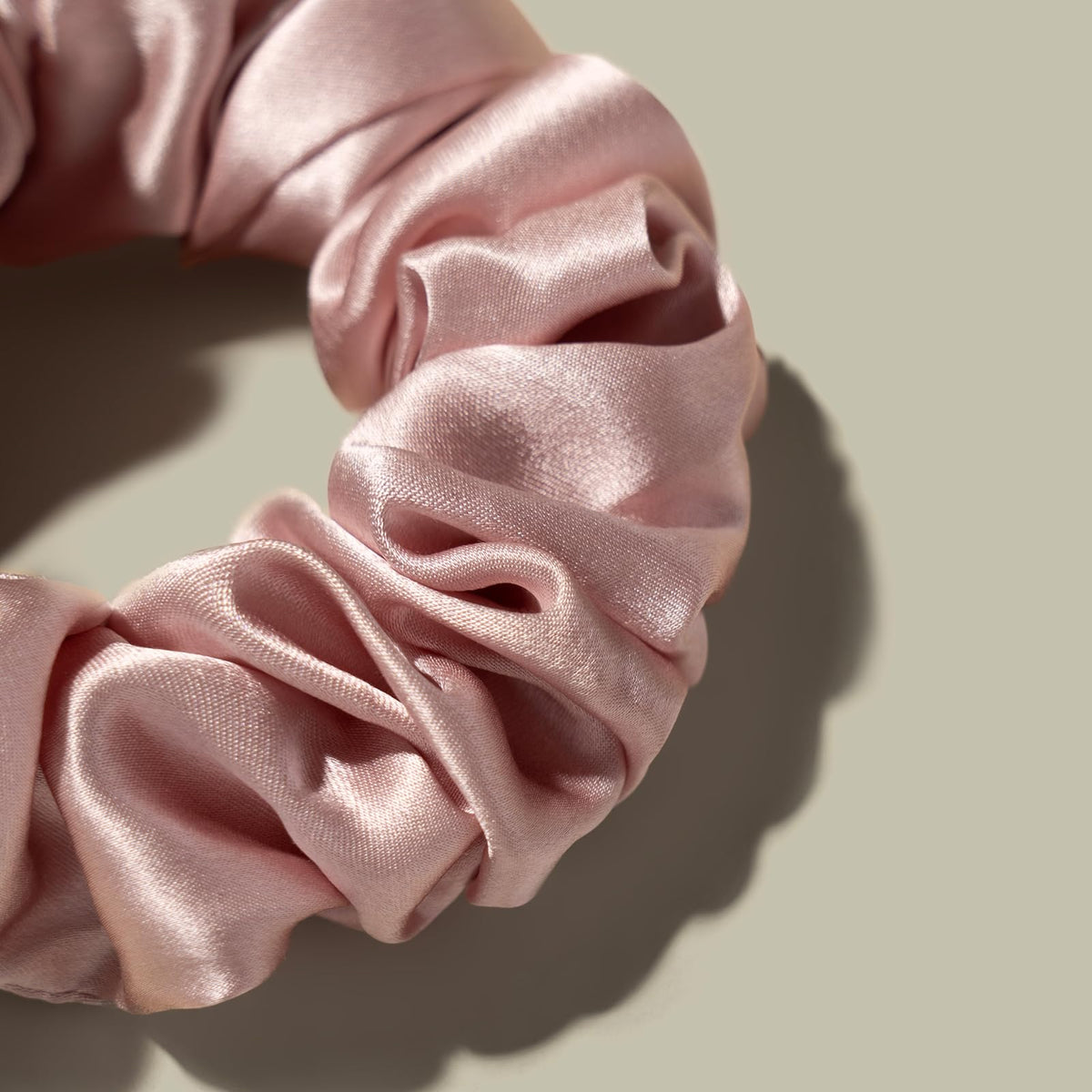 LilySilk scrunchie worn in a low ponytail demonstrating gentle hold and no crease