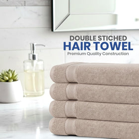 Linteum Textile Supply folded towel edge detail showing double-stitched durability