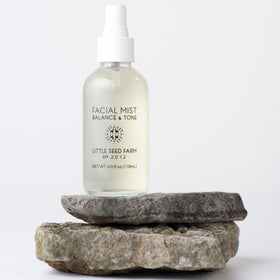 Little Seed Farm lifestyle shot on bathroom vanity promoting gentle routine