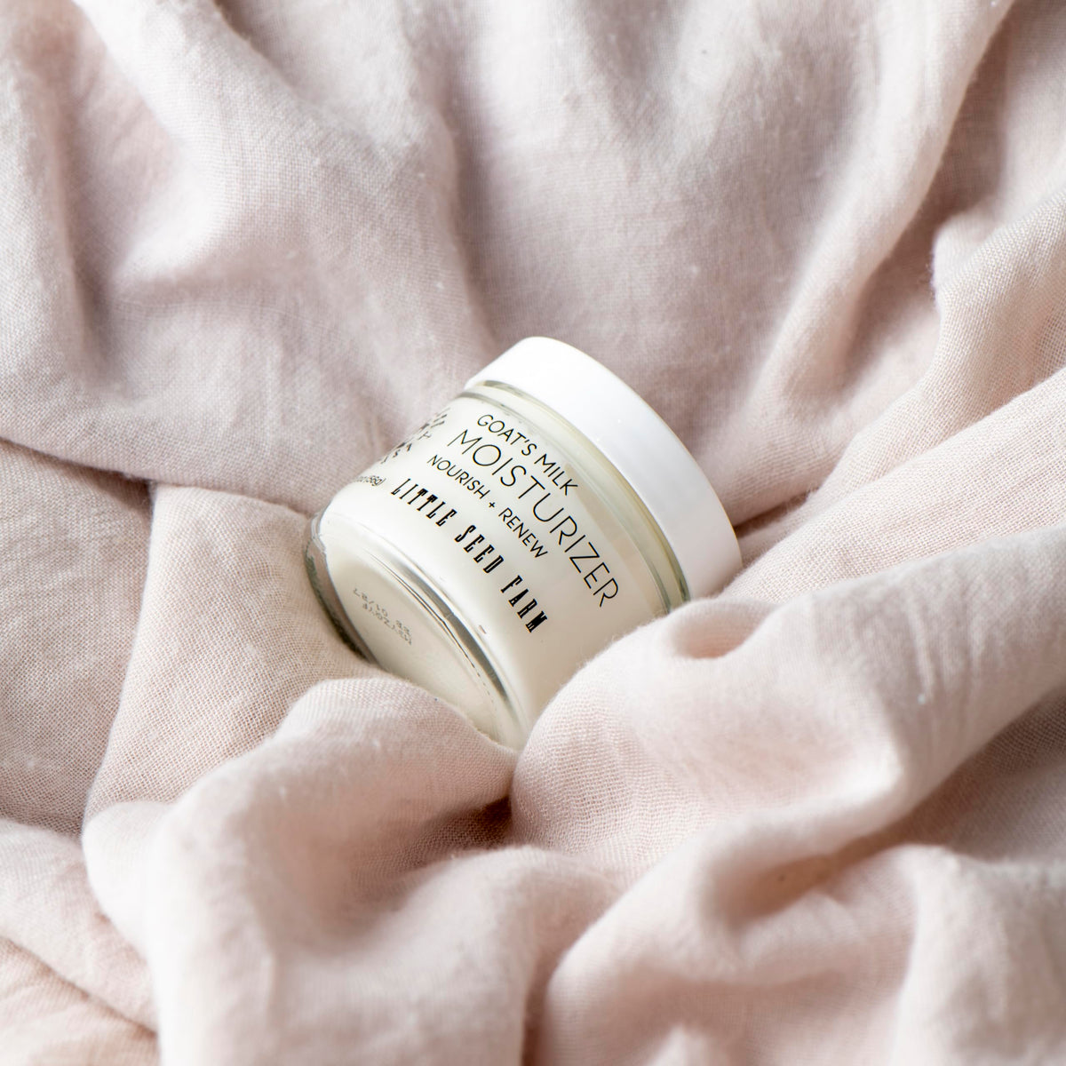 Little Seed Farm cream being smoothed on skin demonstrating lightweight hydration