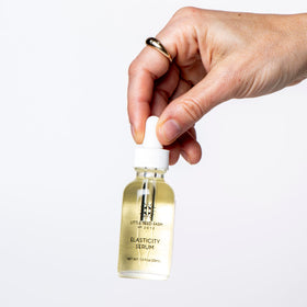 Little Seed Farm applying serum to jawline illustrating easy everyday use