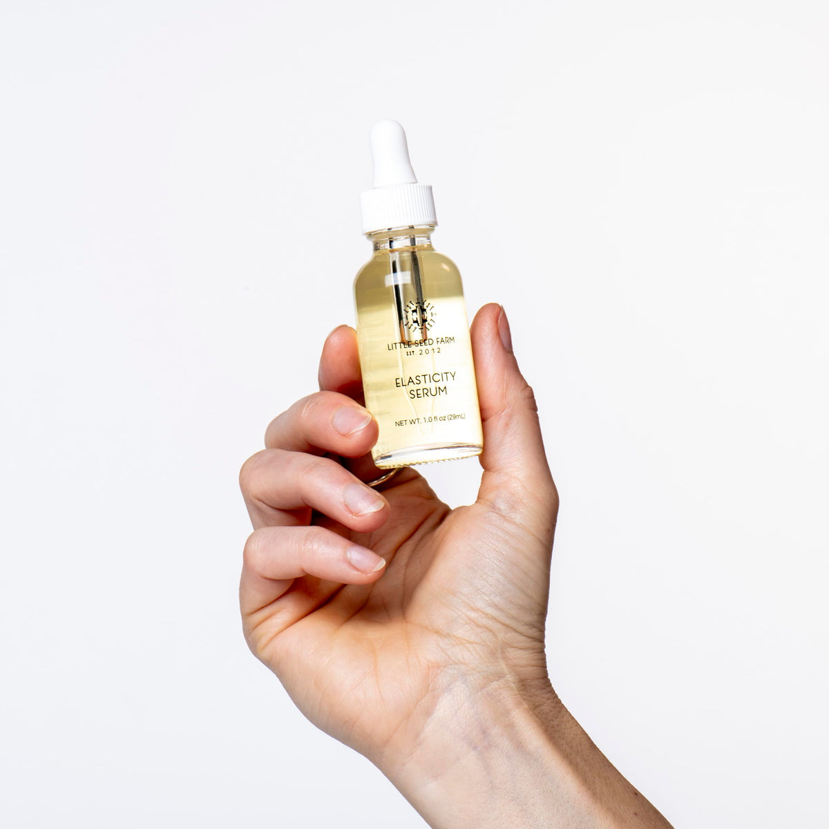 Little Seed Farm serum on bathroom shelf showing routine-ready, elegant display