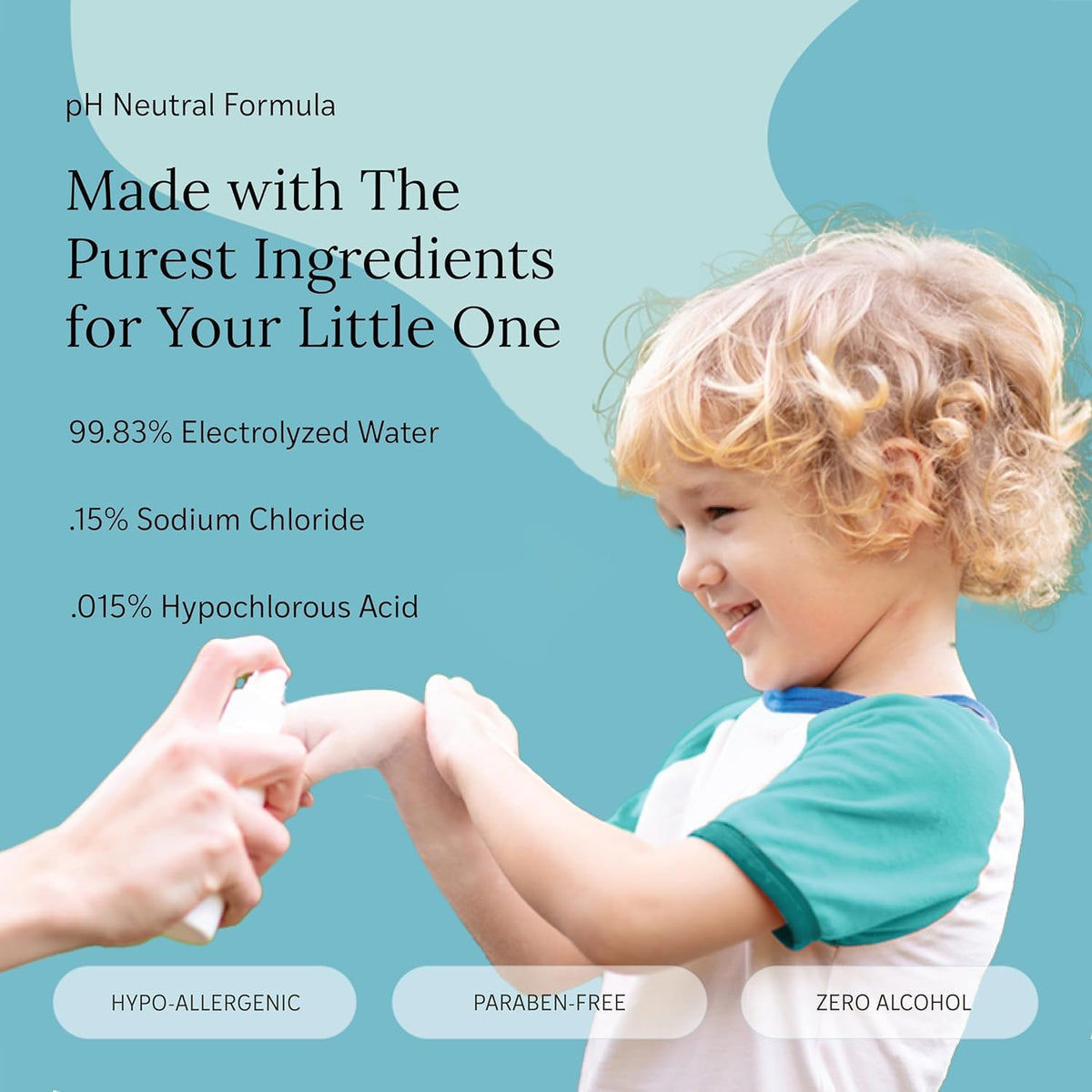 LITTLEY in use parent spraying child hands showing convenient on-the-go cleaning
