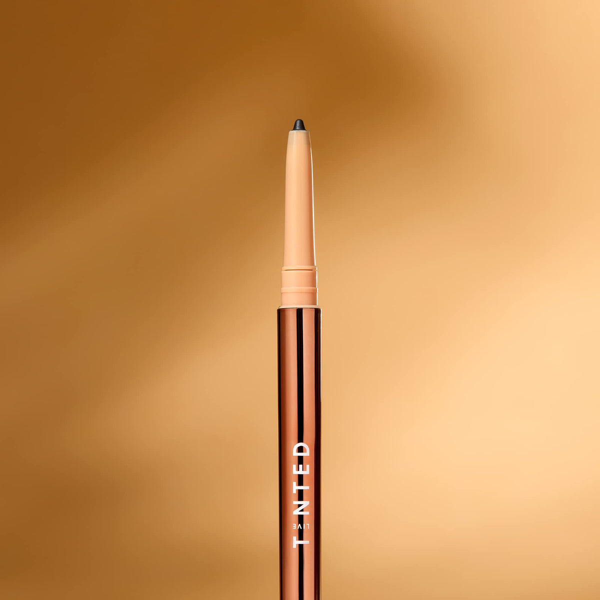 Live Tinted Hueliner in a makeup bag lifestyle shot for travel-ready convenience