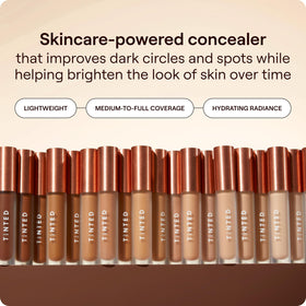 Live Tinted Hueskin tube application close-up demonstrating creamy applicator and coverage