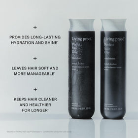 Living Proof 8 oz bottle in hand for size reference and travel-friendly benefit