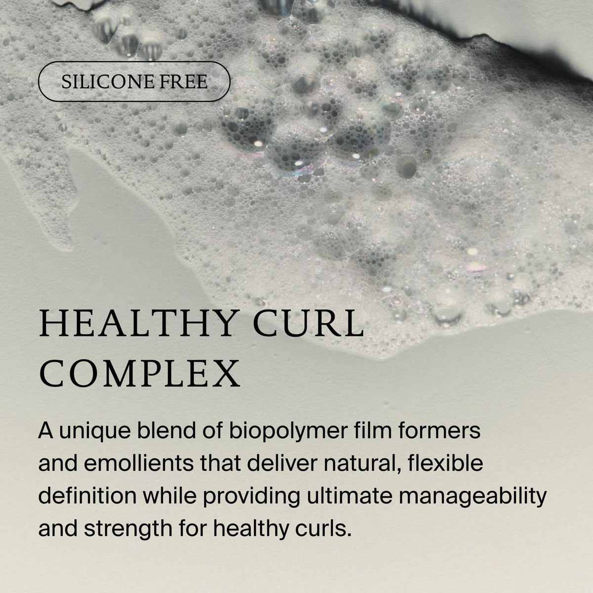 Living Proof curl shampoo on shower shelf showing everyday routine benefit