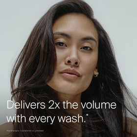 Living Proof full shampoo pouring drop shows lightweight formula
