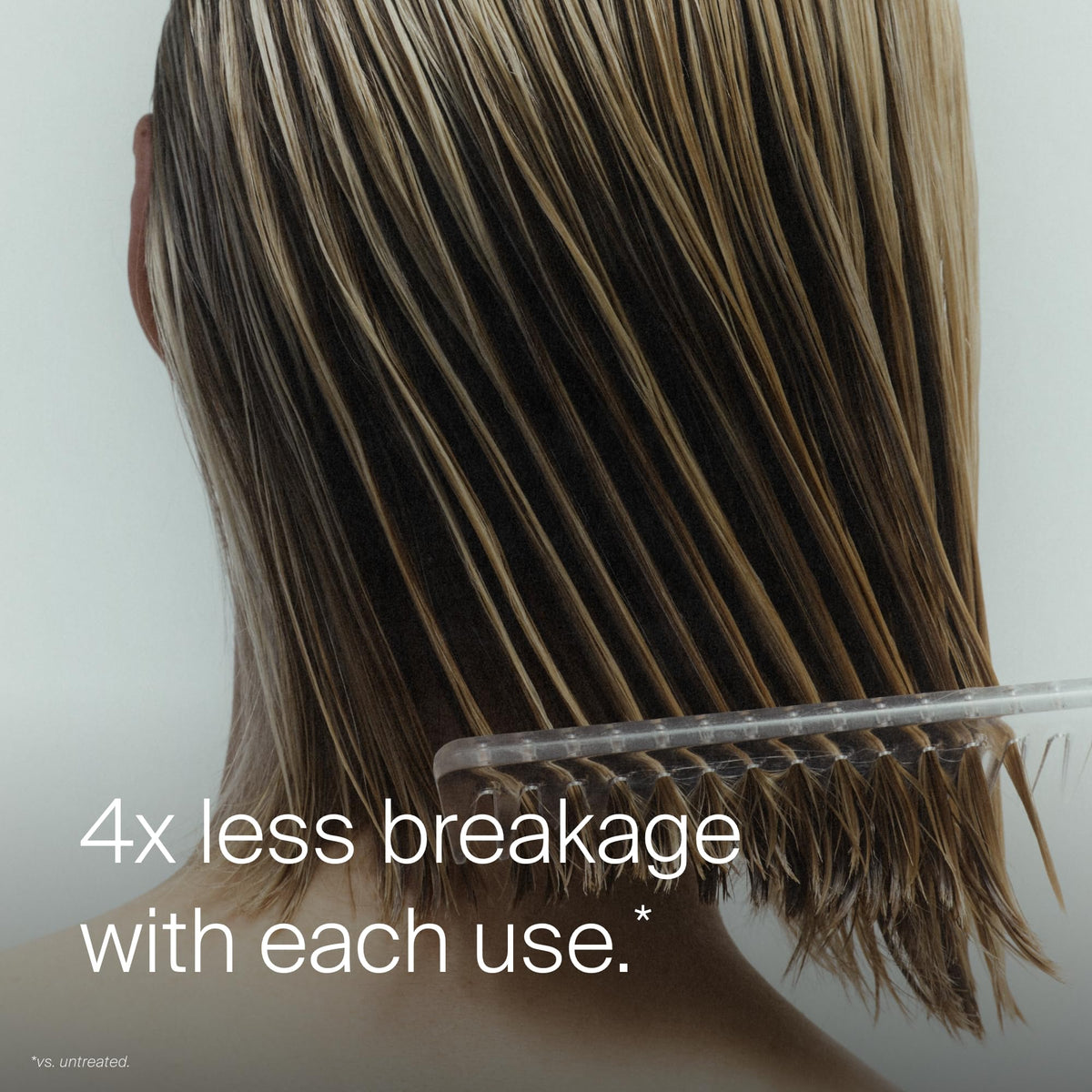 Living Proof being misted on wet hair for quick detangling benefit