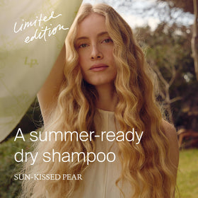 Living Proof limited-edition bottles on shelf highlighting sun-kissed pear scent