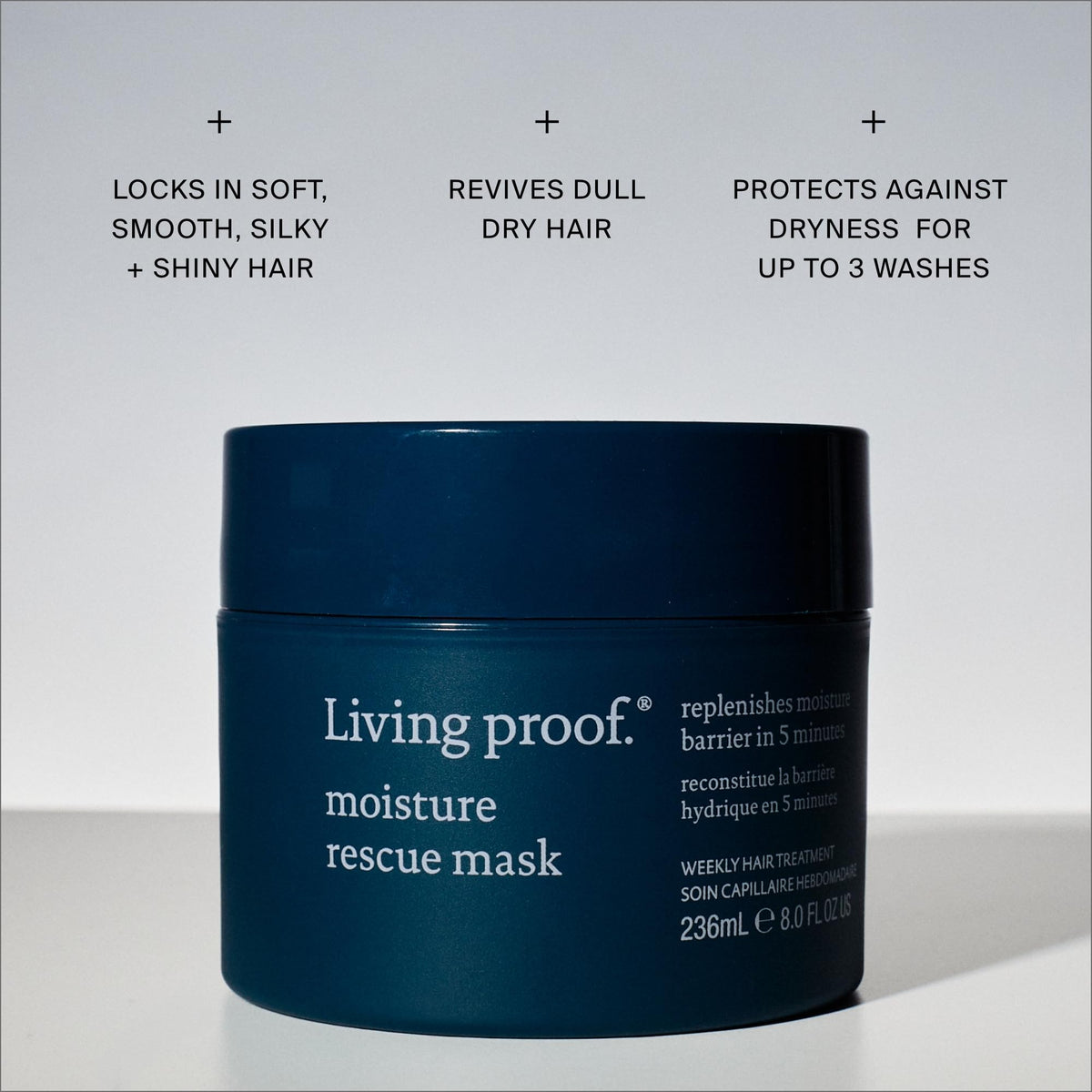 Living Proof 8 oz jar beside cap showing product size and scale