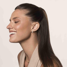 Living Proof styled hair outdoors showing reduced frizz and shinier finish benefit