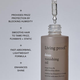 Living Proof applying oil to mid-lengths and ends for smoothing benefit