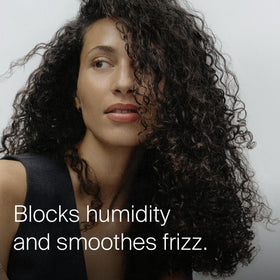 Living Proof oil texture drops on surface demonstrating lightweight absorption