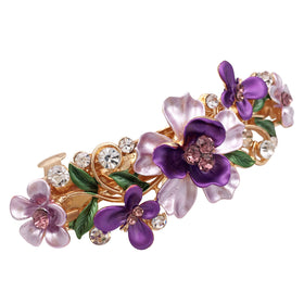 Lizzie Kay pink barrette close-up showing floral metal detail, elegant accent