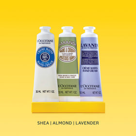 L'Occitane almond cream spread on palm illustrating smooth hydration and scent