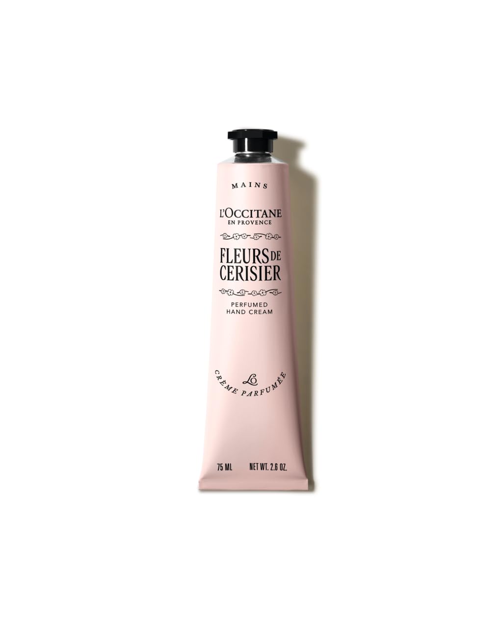 L'OCCITANE front packaging showing full 2.6 oz tube and cherry blossom design, suggests luxury hydration