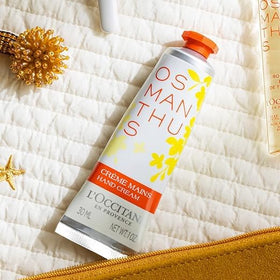 L'OCCITANE hand cream tubes styled on vanity indicating daily routine and elegance
