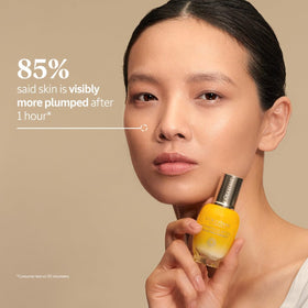 L'Occitane Immortelle Divine Serum texture spread on skin illustrating lightweight absorption