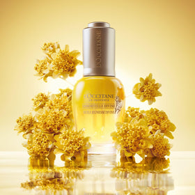 L'OCCITANE 30ml bottle next to coin showing travel-friendly size benefit