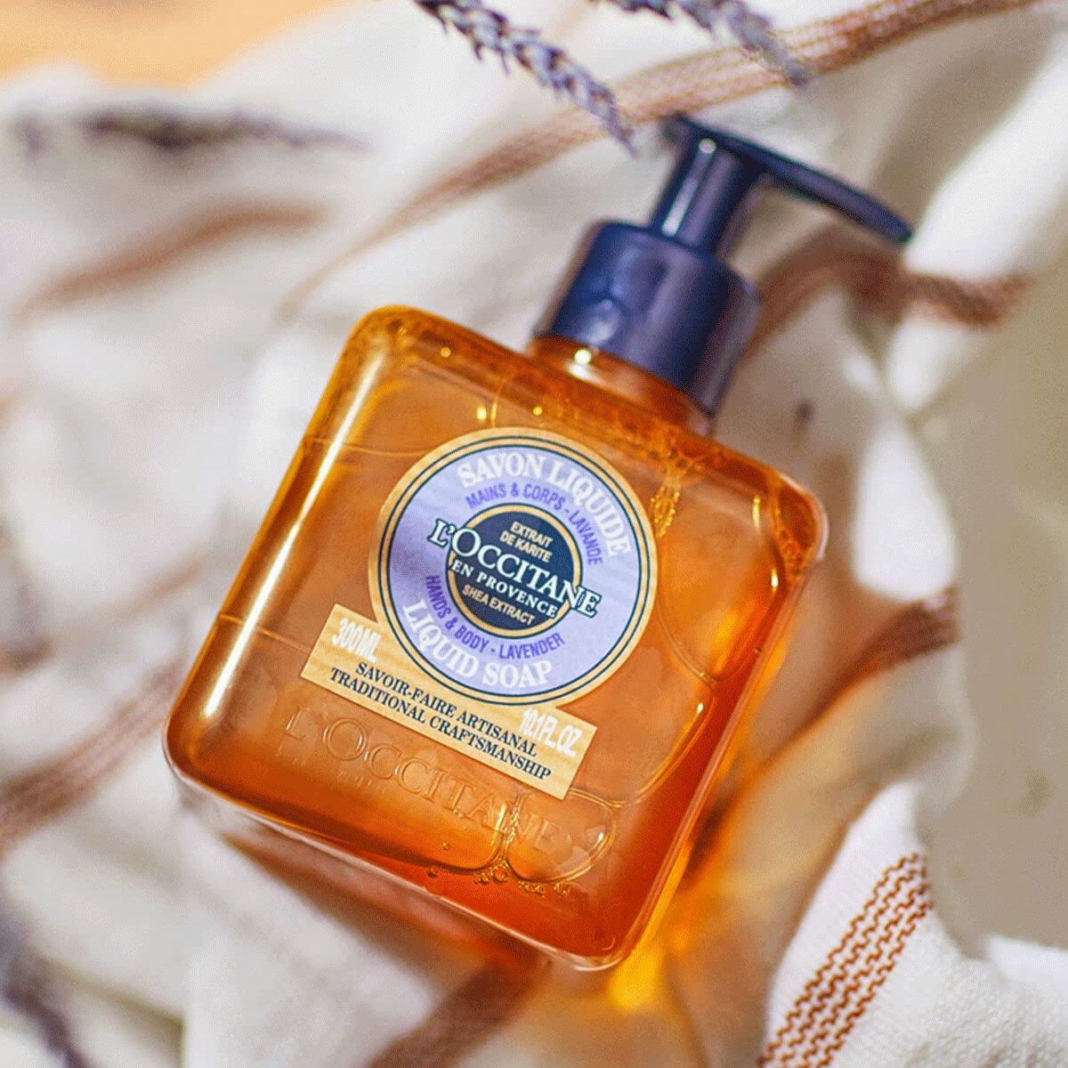 L'OCCITANE bottle in bathroom setting suggesting relaxing lavender ritual