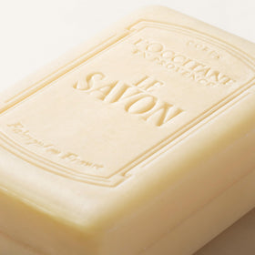 L'OCCITANE label close-up revealing Shea Extract and vegan formulation benefit