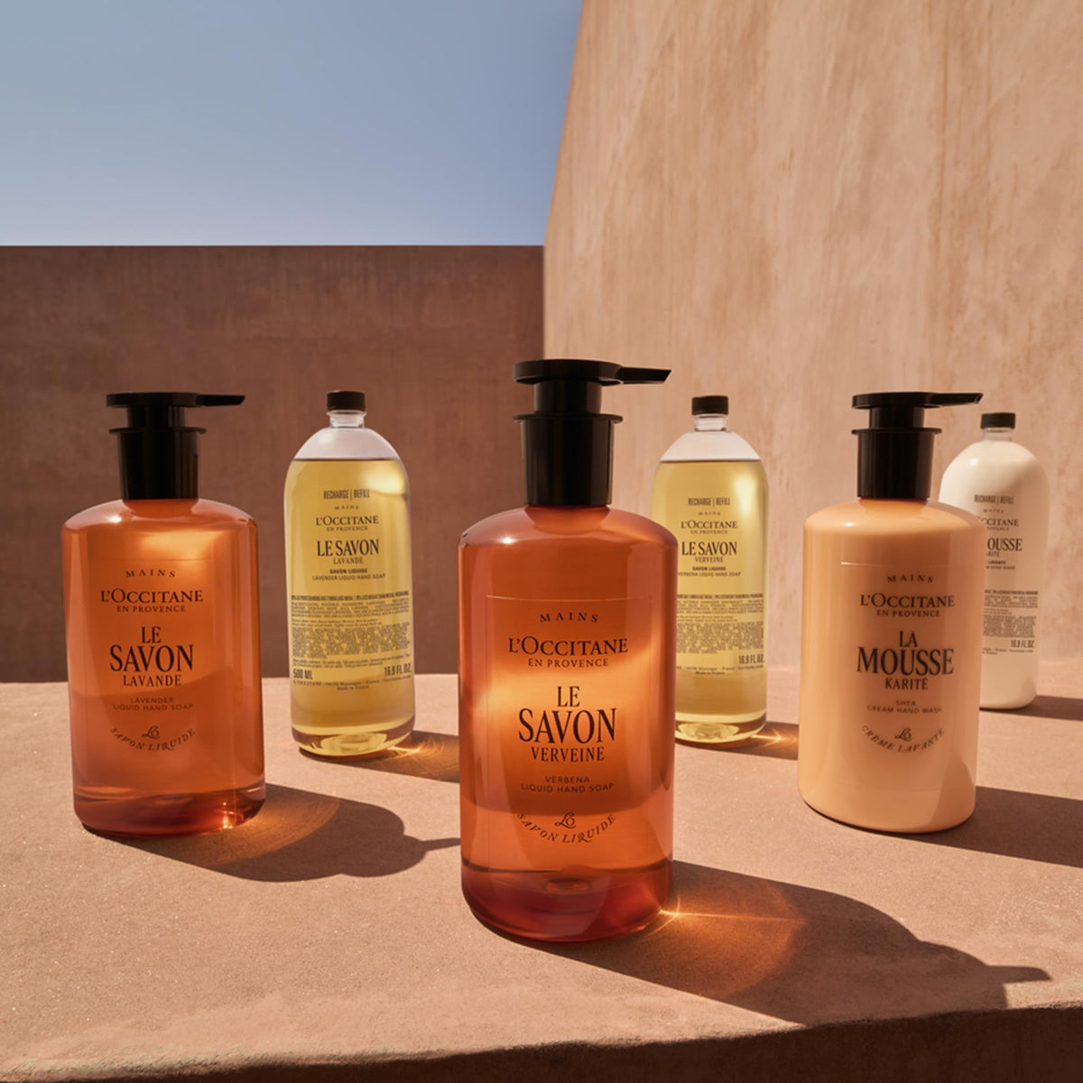 L'OCCITANE with verbena leaves emphasizing natural citrus aroma benefit