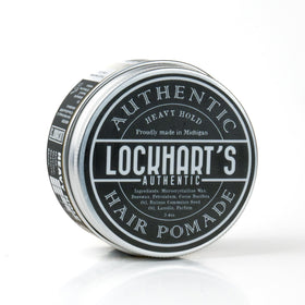 Lockhart's pomade in hands while applying for precise control