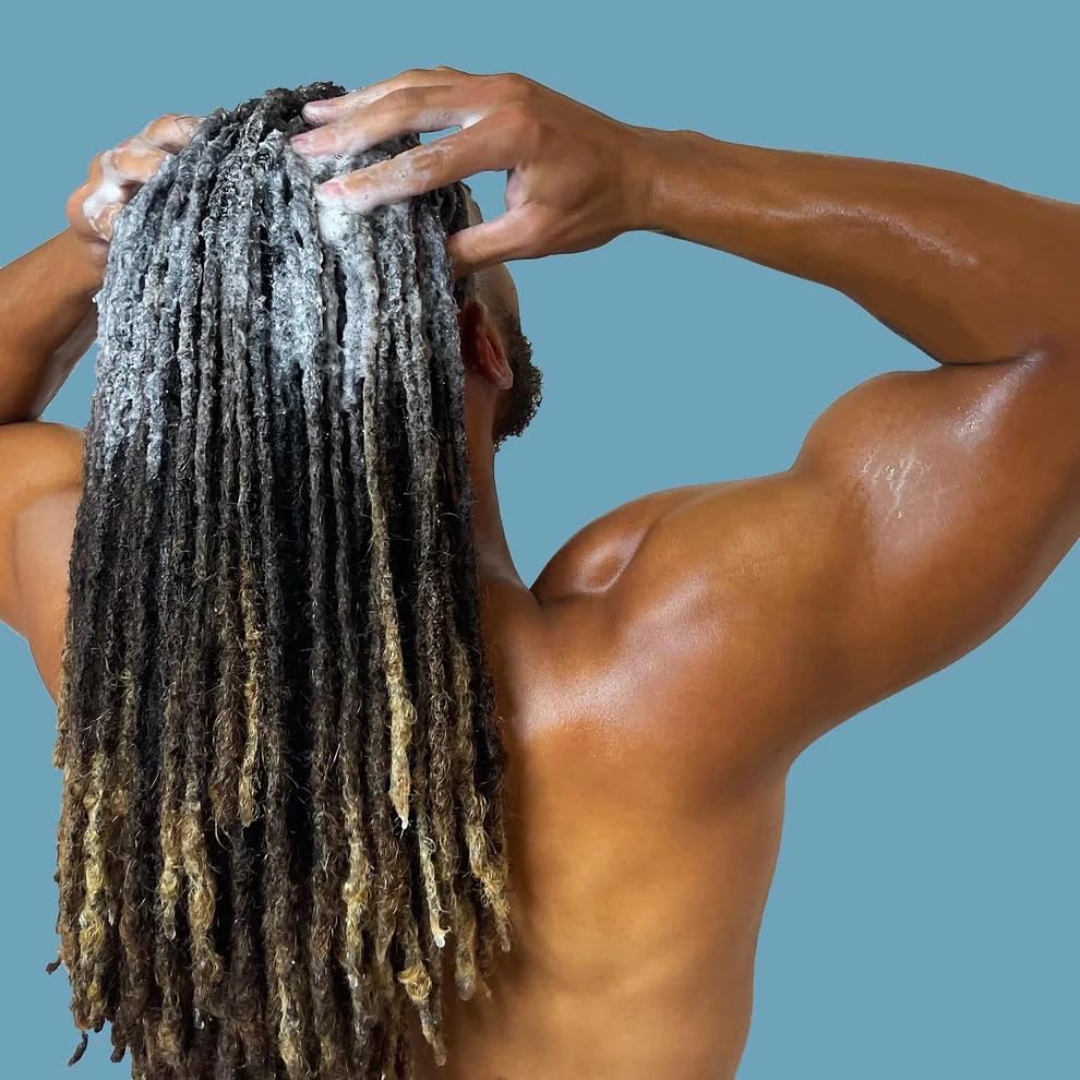 LOCssentials shampoo being applied to wet locs for effective residue removal