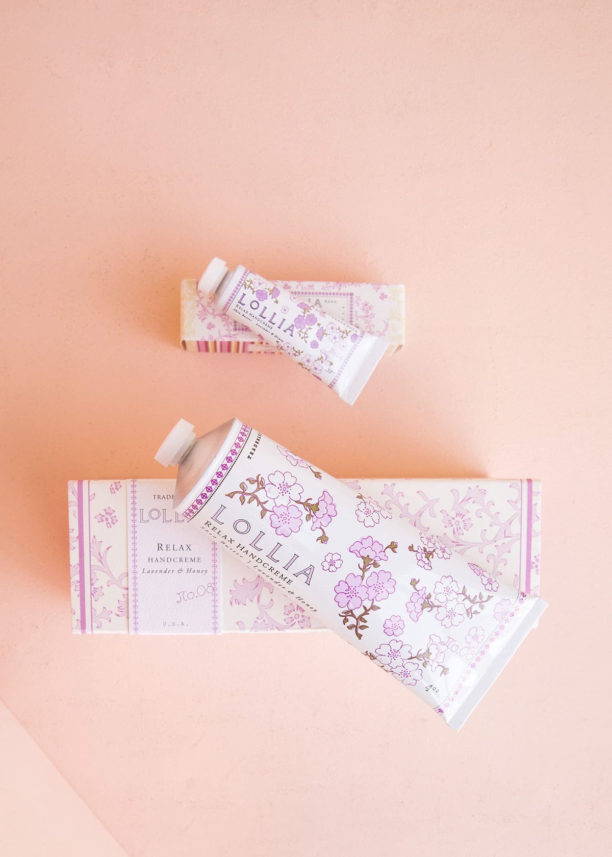 LOLLIA travel size in hand showing portable .33 oz for on-the-go hydration