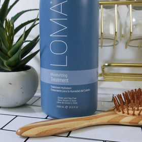 Loma ingredient label close-up showing quinoa, creatine, and oils for repair benefit