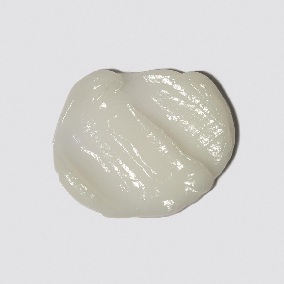 Loma conditioner cream texture swirled to show lightweight, non-greasy formula
