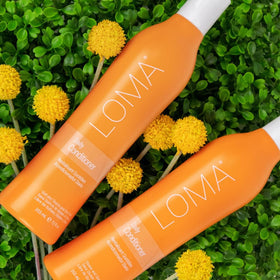LOMA conditioner in bathroom lifestyle scene illustrating daily use and salon-finish results