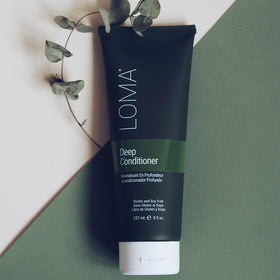 LOMA bottle on bathroom shelf styled to show clean-beauty routine and freshness