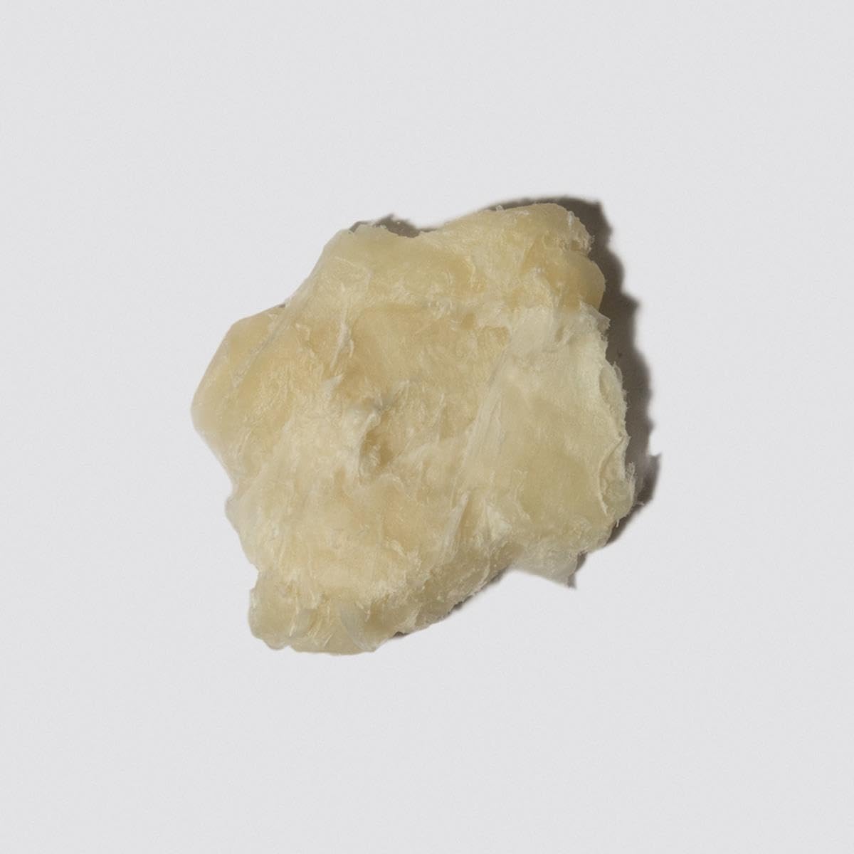 Loma forming paste used by person styling hair by mirror for defined look