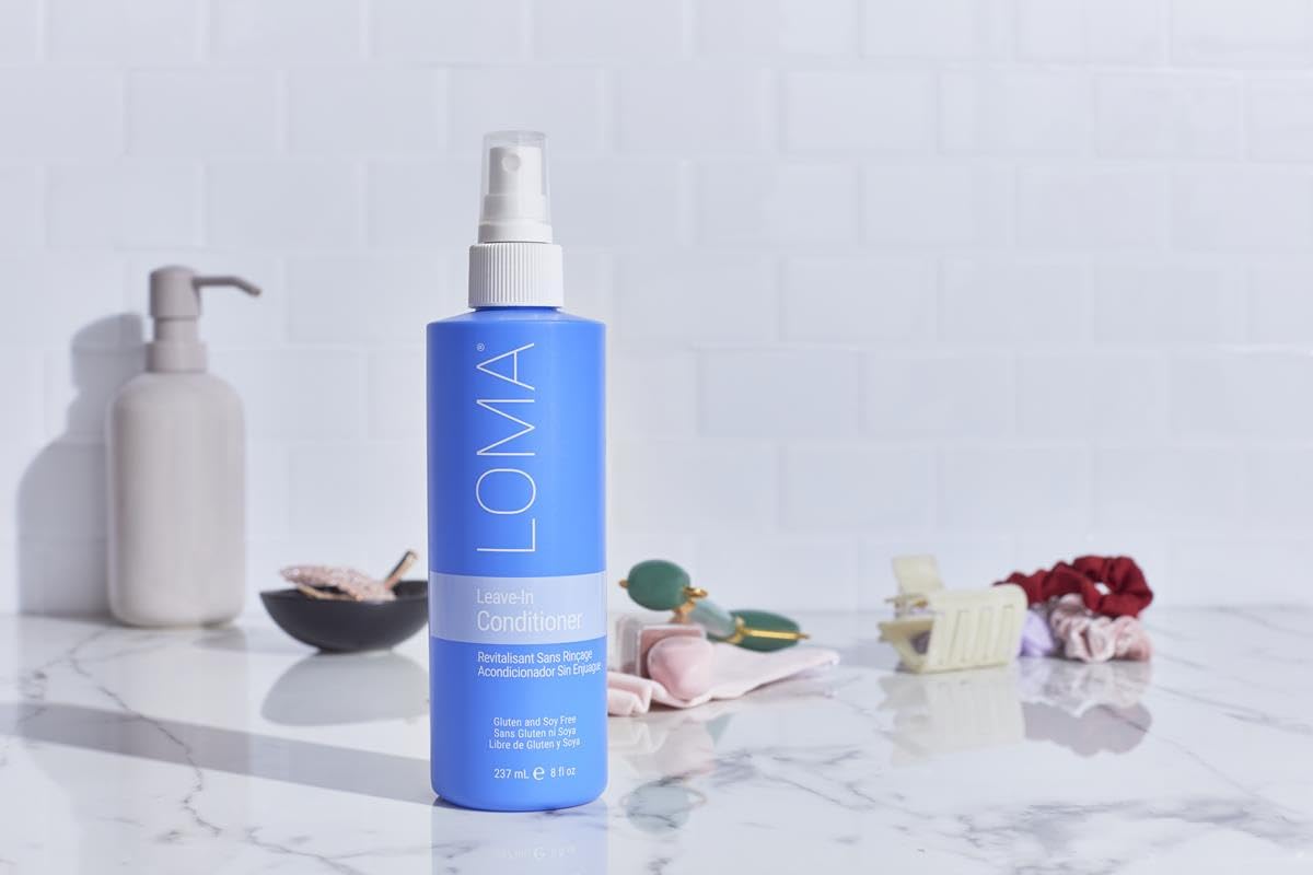 Loma leave-in on bathroom shelf styled to show pear aromatherapy and everyday use