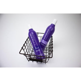 Loma pouring shampoo from bottle into hand displaying easy application and control